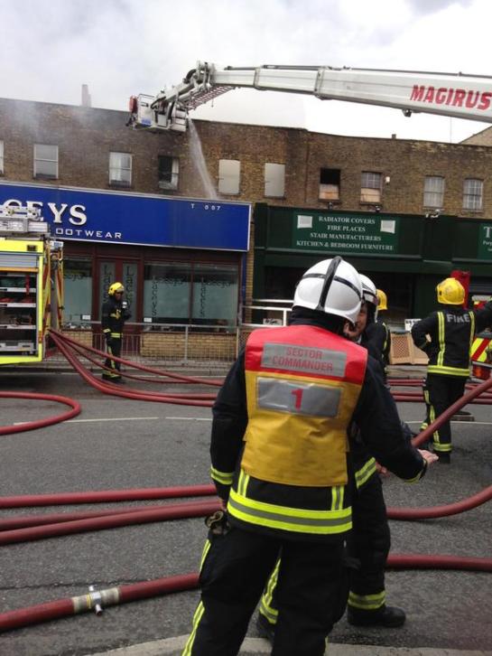 Crews are currently working hard to contain a substantial fire in a row of shops in Hackney. (Image: LFB BEXLEY ‏@bexleyfire)